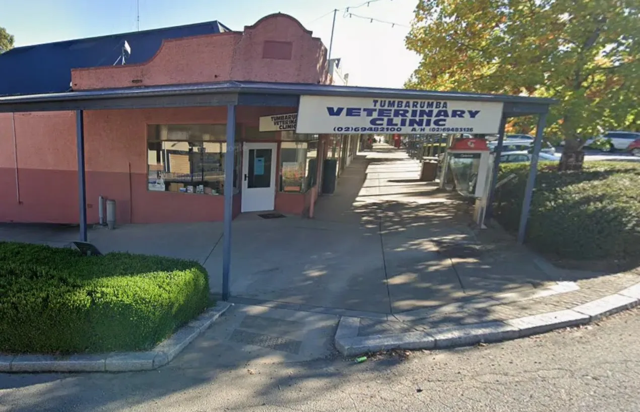 Pink building with blue roof and sign reading Tumbarumba Veterinary Clinic