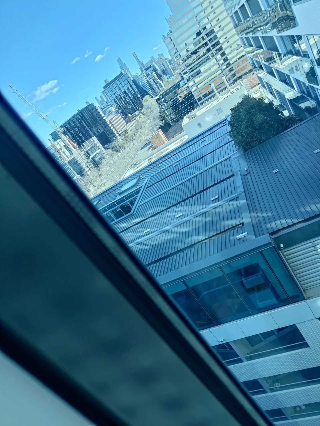Buildings and construction site under blue sky